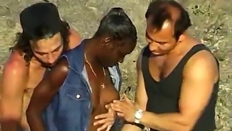 Three Guys And A Black Girl Enjoy A Threesome At The Beach